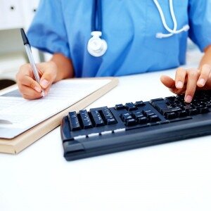 Dentist working on computer