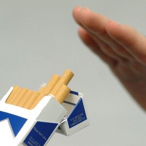 cigarette pack and hand